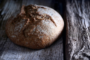 Rustic bread on a wooden table. 