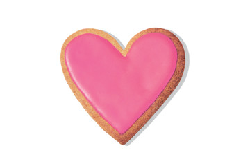Decorated heart shaped cookie on white background, top view