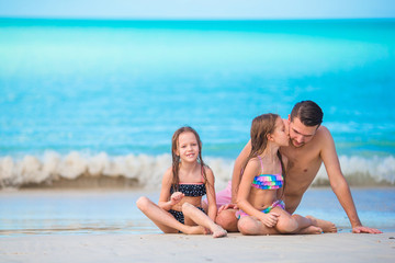Father and kids enjoying beach summer vacation