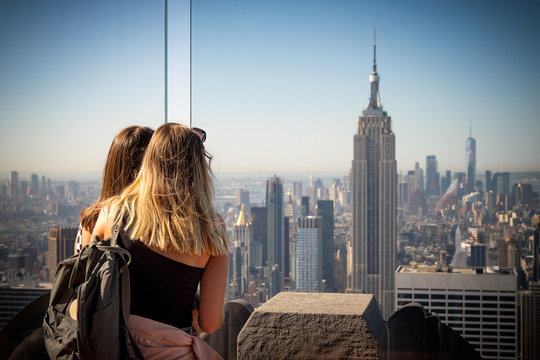 Young girls watching New York skyline