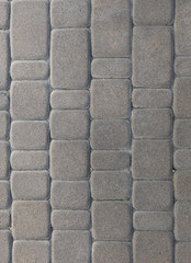Texture of stone sidewalk tile. Background vertical image, place for text.