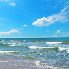 Fototapeta na wymiar Beautiful sea and blue sky. Sand beach. The concept is travel.