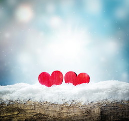 Winter snow bright background. Holiday landscape with wood, snowdrifts and heart in the frost.