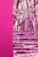 This is a photograph of an abstract background created by organizing stripes created using Purple glitter paint and Fuschia Pink acrylic paint