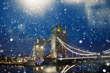 Tower bridge of London in snow at dawn. 