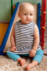 The physical development of the child. Children's sport. Children's gym complex at home. Exercise on the simulator. Healthy child, healthy lifestyle