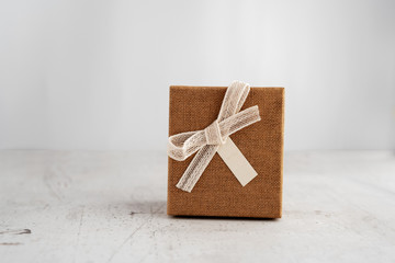 Gift box on a light background. Scenery for the holiday. Congratulations, new year, birthday.