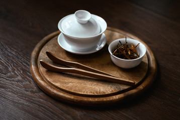 Tableware for tea ceremony on a wooden tray
