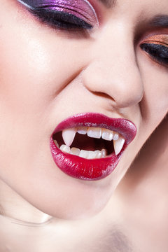 Sexy vampire. Women's lips with red lipstick.