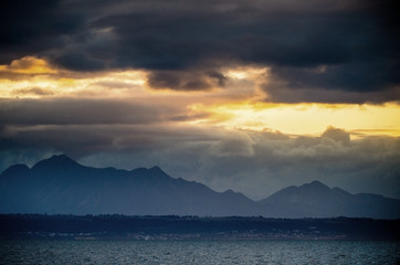 Seascape. Clouds, red sunrise sky, Mossel bay. South Africa.