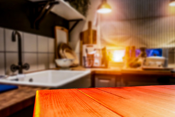 Kitchen table top with empty space for you products or decoration and blurred kitchen furniture background.