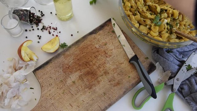 Personal perspective of woman hands cooking Amanita caesarea (known as Caesar's mushroom)