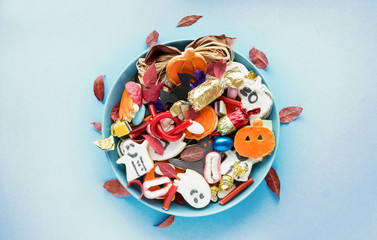 Halloween holiday card - candy bowl with candy and halloween cookies Trick or Treat	 