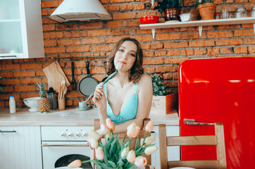Portrait of a pretty woman on a kitchen background