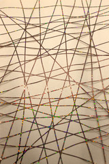 This is a photograph of a geometric design created using colorful tape applied onto a paper