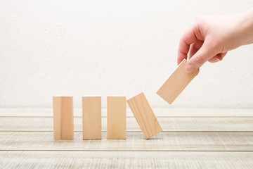 hand put wooden dominoes in a row white background, frontal feed, rectangles for your inscription 5...
