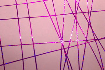 This is a photograph of a geometric design created using Purple tape applied onto a Pink paper