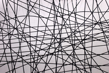 This is a photograph of a geometric design created using Black tape applied onto a White paper