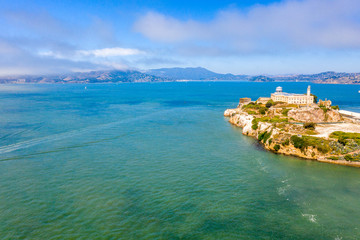 Beautiful aerial view of the Alcatraz island with Golden Gate bridge on the background in San...