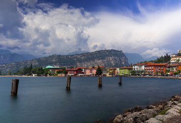 sunny day at torbole - a colorful village infront of monte brione at lake garda situated in trentino northern italy