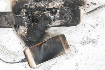 the burned-down power supply, phone, possible cause of the fire