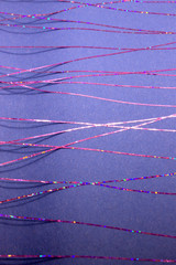 This is a photograph of a abstract geometric design created using colourful tape applied onto a Blue paper