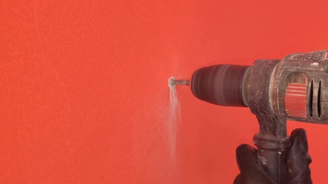 Human hand Working on drilling wall,manual construction job,industrial tools,4k 