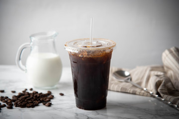 iced coffee in disposable plastic cup