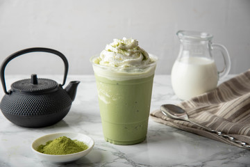matcha frappuccino in plastic cup