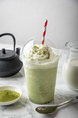 matcha frappuccino in plastic cup