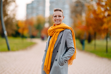 Portrait of happy woman standing in the park