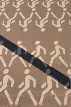 Pictogram of people walking in rows