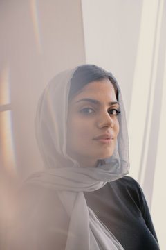 Thoughtful woman wearing blue hijab