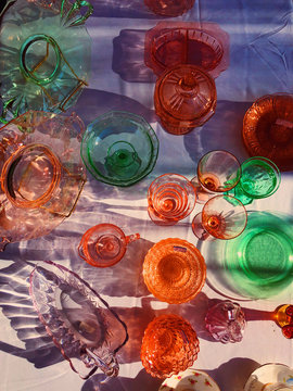 Overhead view of colorful vintage glass trays and plates