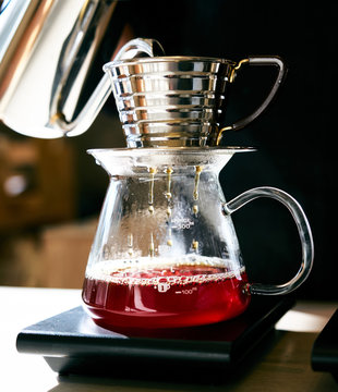 Filter coffee brewing dripping into carafe