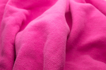 This is a photograph of textured Fuschia Pink fabric Background