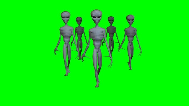 Group of aliens walking on a green screen.mov