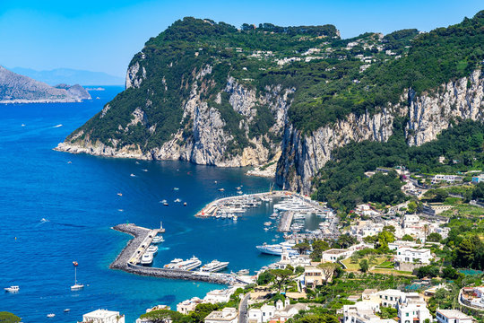 Amazing landscape of Capri Island with Marina Grande harbour and Punta del Capo viewed from Phoenician Steps (Scala Fenicia), Campania, Italy