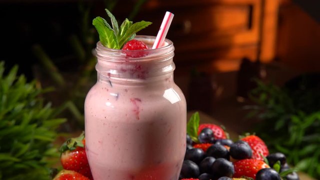 Close-up shot 2in1 of fresh fruit smoothie in glass, homemade delicious yogurt full of vitamins. Nourishing fruit milkshake for diet, healthy eating and detox concept