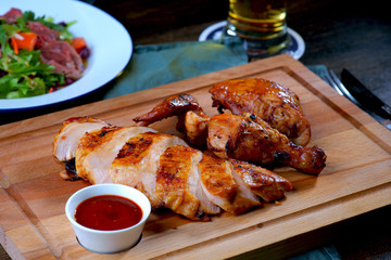 grilled chicken on wooden pallet