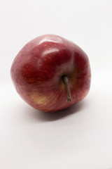 This is a photograph of a Red Apple isolated on a White background