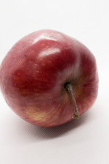 This is a photograph of a Red Apple isolated on a White background