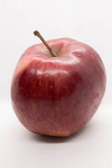 This is a photograph of a Red Apple isolated on a White background