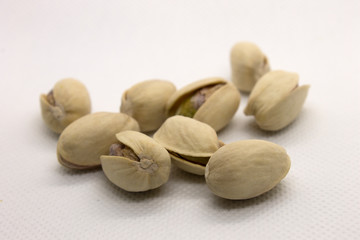 This is a photograph of Pistachios isolated on a White background