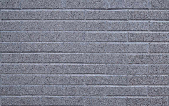 Brick wall with grey marble texture blocks