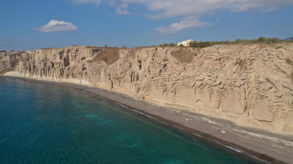 Aerial drone photo of amazing shape giant volcanic rock formations in Vlychada beach, Santorini island, Cyclades, Greece