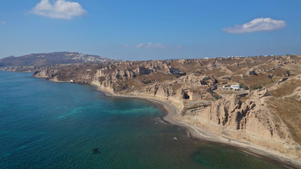Aerial drone photo of amazing shape giant volcanic rock formations in Vlychada beach, Santorini island, Cyclades, Greece