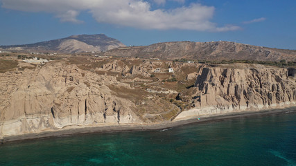 Aerial drone photo of amazing shape giant volcanic rock formations in Vlychada beach, Santorini island, Cyclades, Greece
