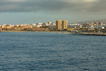Los Cristianos - Las Americas, Tenerife, Spain - May 25, 2019: View to the coastline from the ferry departing for the island of La Gomera early morning from the port of Los Cristianos