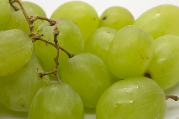 This is a photograph of Green Grapes isolated on a White background